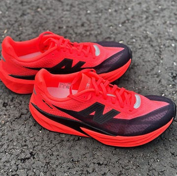 a pair of red and black running shoes a pair of red and black running shoes