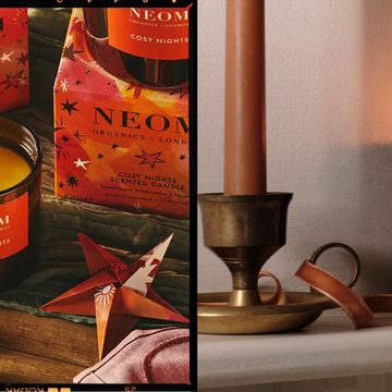 two christmas candles, one from neom and one from cowshed
