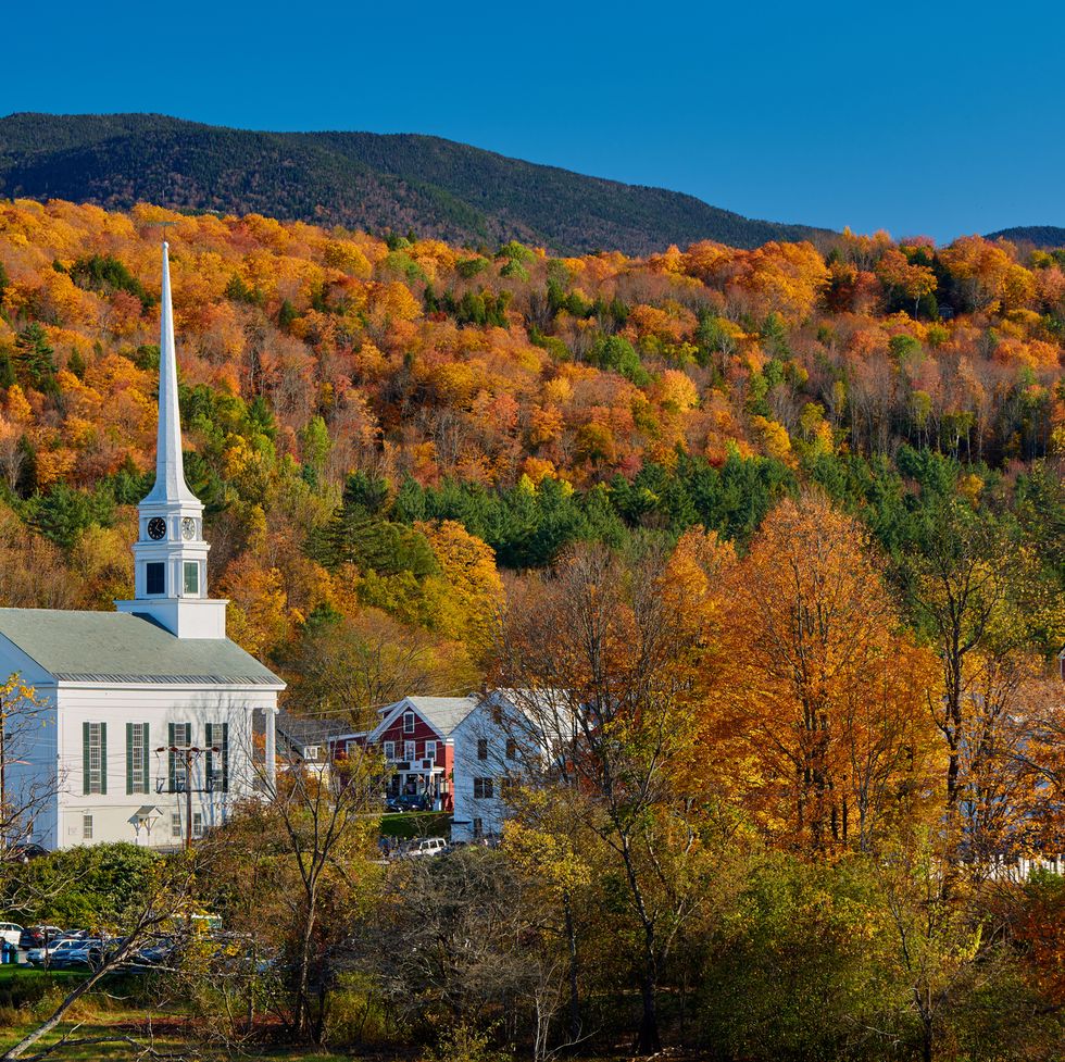 iconic new england church in stowe town at autumn