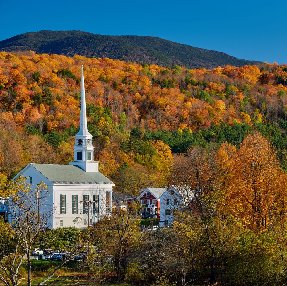 iconic new england church in stowe town at autumn
