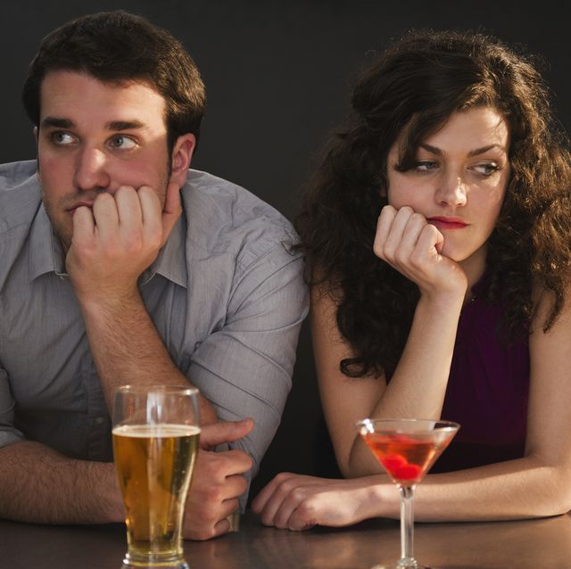 usa, new jersey, jersey city, bored couple sitting at bar counter