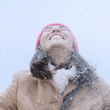 usa, new jersey, jersey city, woman in snowfall