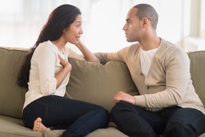 usa, new jersey, jersey city, young couple sitting on couch