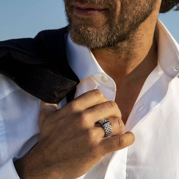 close up of a man wearing a fope ring