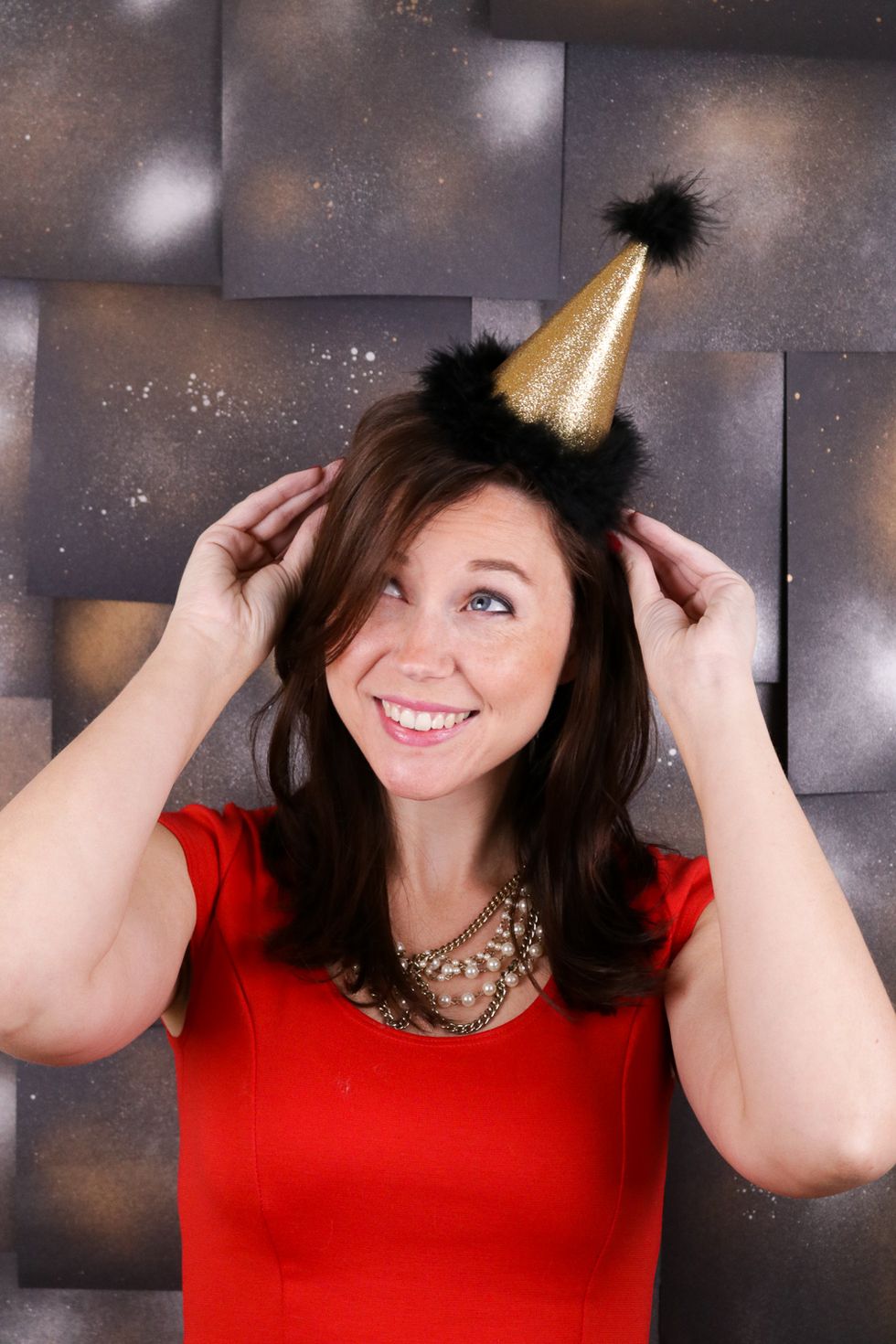 Woman wearing mini party hat headband