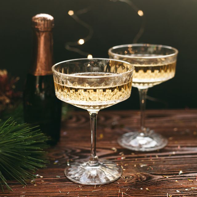 https://hips.hearstapps.com/hmg-prod/images/new-year-greeting-card-champagne-vintage-glasses-royalty-free-image-1670770865.jpg?crop=1.00xw:0.668xh;0,0.184xh&resize=640:*