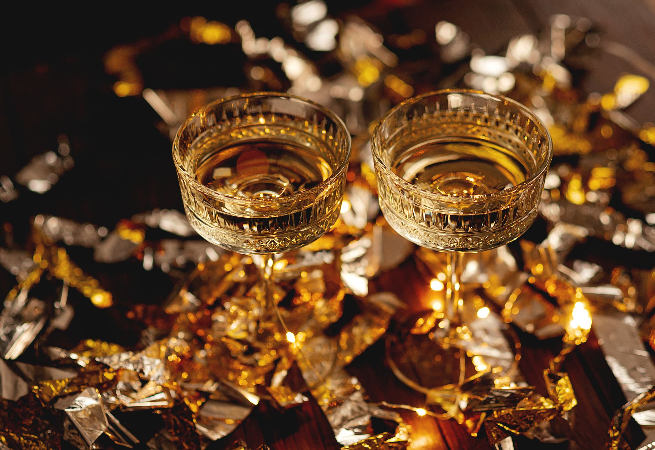 https://hips.hearstapps.com/hmg-prod/images/new-year-greeting-card-champagne-vintage-glasses-royalty-free-image-1702050620.jpg