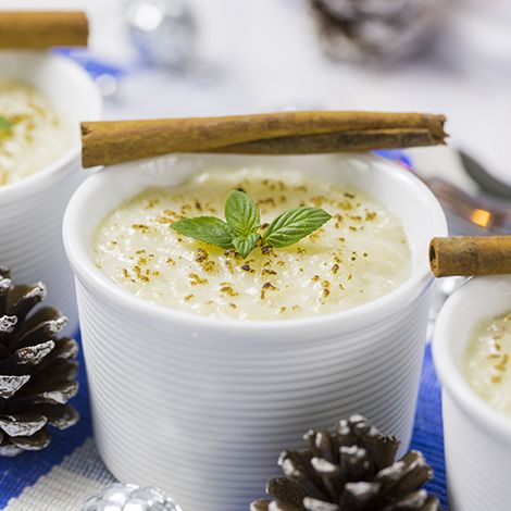 rice pudding with cinnamon, new year ornaments in blue color in new year traditions