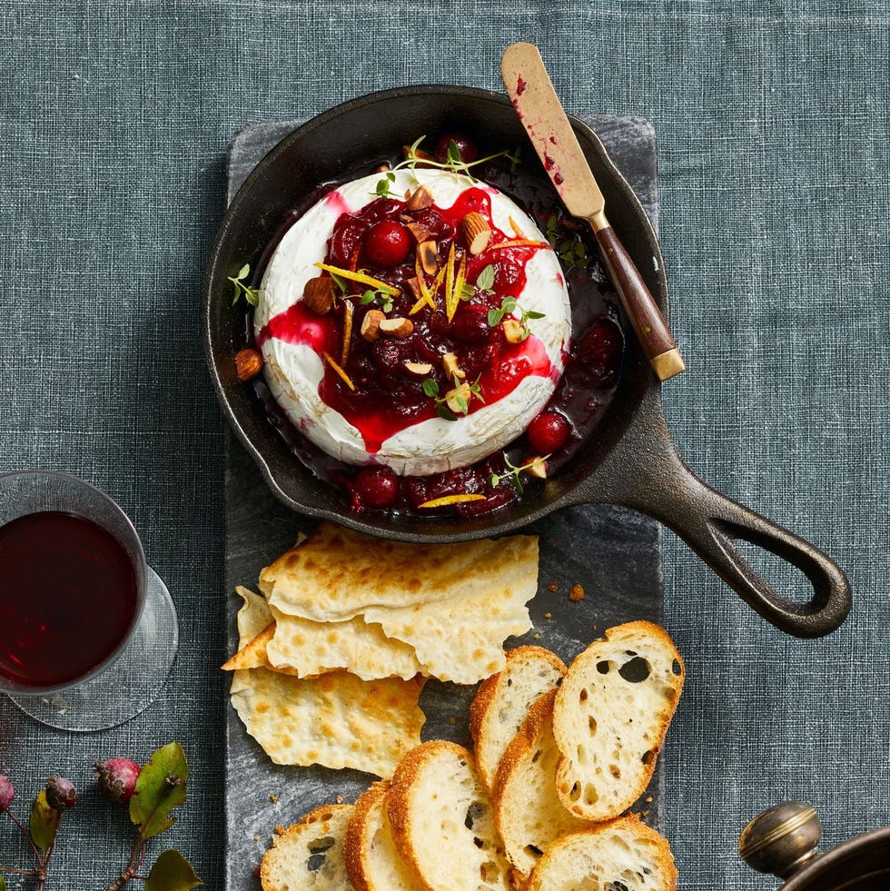 cranberry baked brie in a cast iron pan