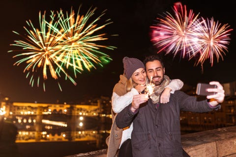 couple taking selfie on new years