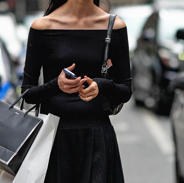 a woman holding a phone