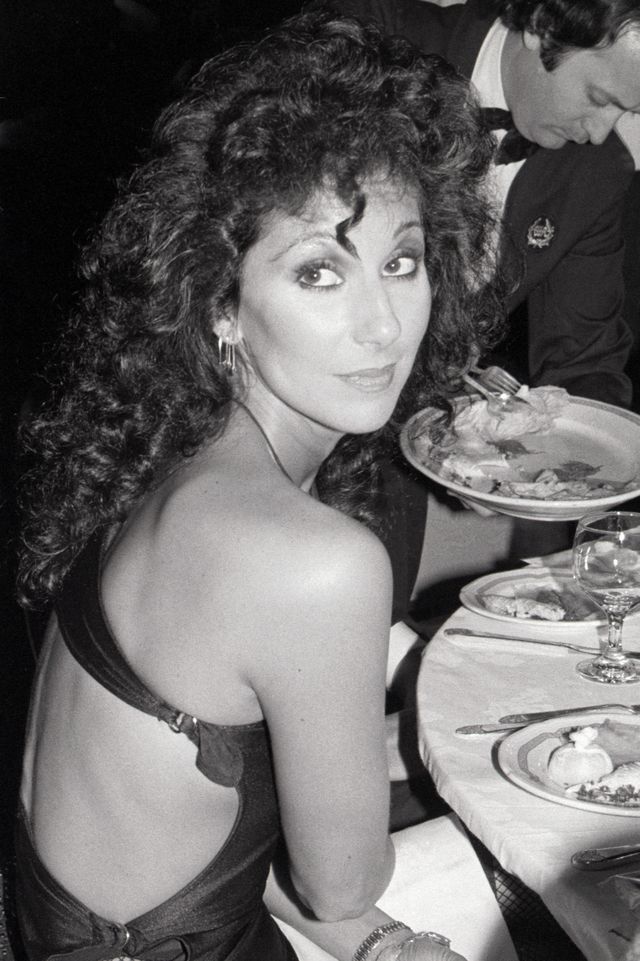 Cher In Cut-Out Dress Eating at Tony Party