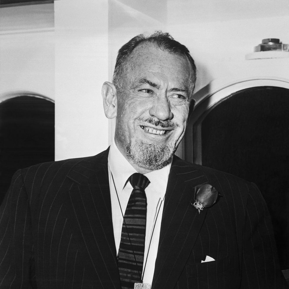 (original caption) 3/19/1954 new york, ny author john steinbeck is shown smiling as he sails with his wife aboard the italian lines saturina, march 19th. the writer and mrs. steinbeck plan to vacation in europe.