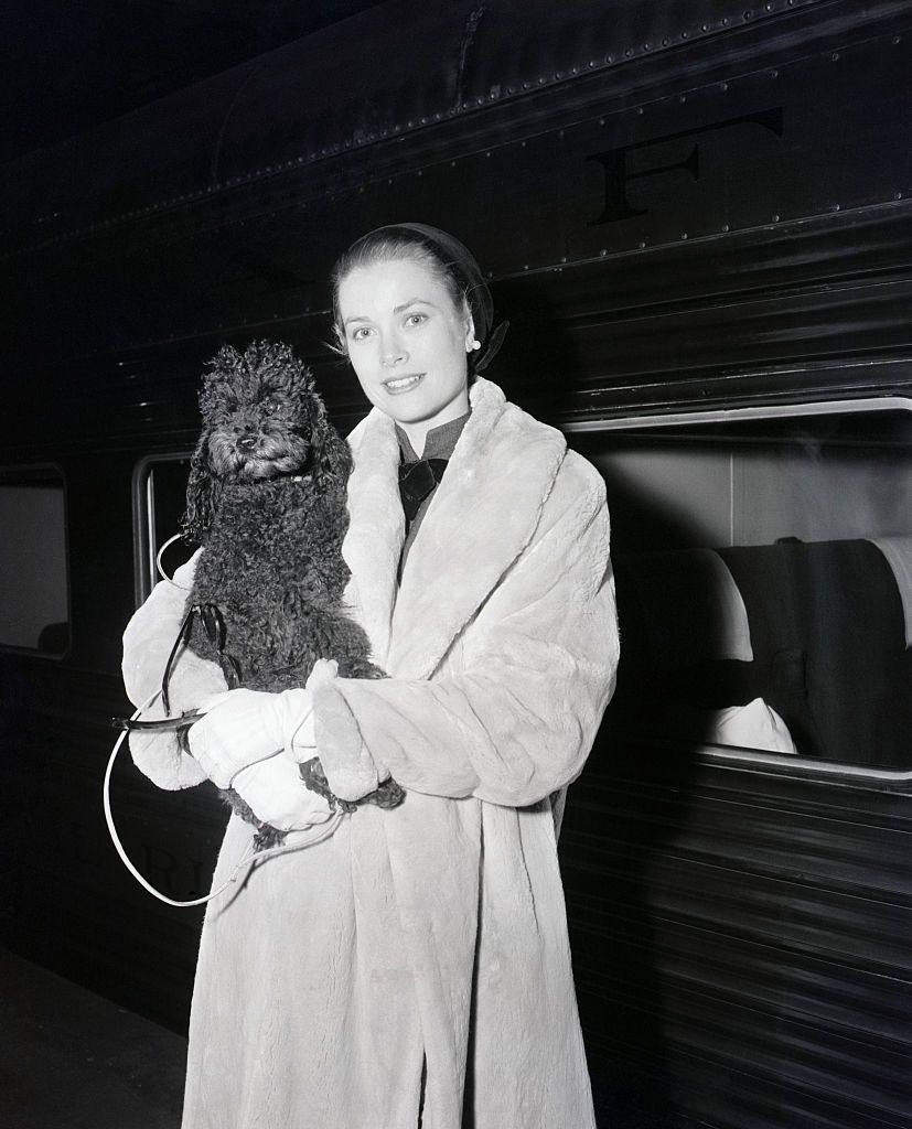 grace kelly poses with poodle fur coat
