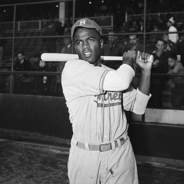 jackie robinson swinging a bat during practice