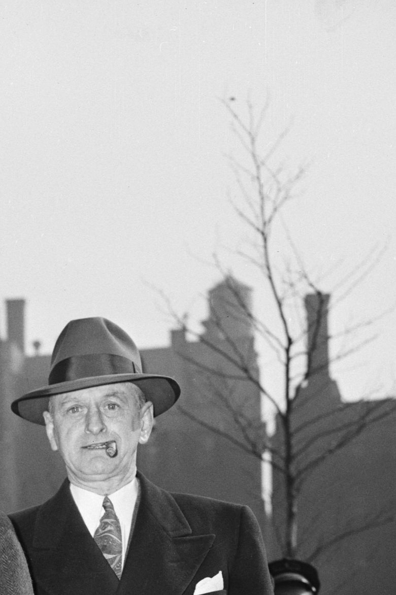 two men wearing hats and walking