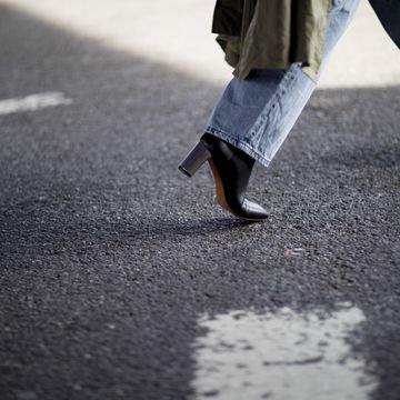 White, Pedestrian, Asphalt, Standing, Human leg, Leg, Footwear, Road surface, Walking, Shoe, 