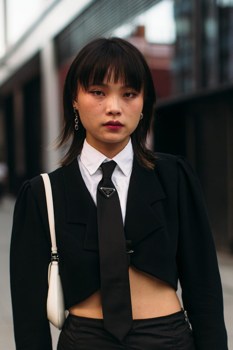 fashionable outfit featuring a cropped blazer and tailored pants best brunette bob haircut for summer