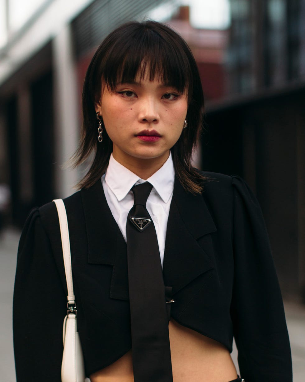 fashionable outfit featuring a cropped blazer and tailored pants best brunette bob haircut for summer