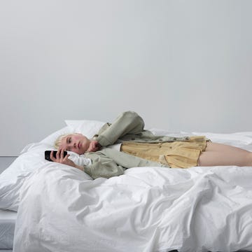 a person lying on a bed