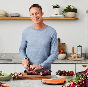 Dr Mark HYman a woman cutting meat