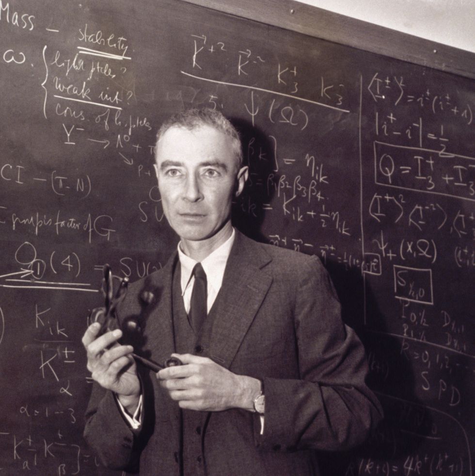 robert oppenheimer standing at blackboard