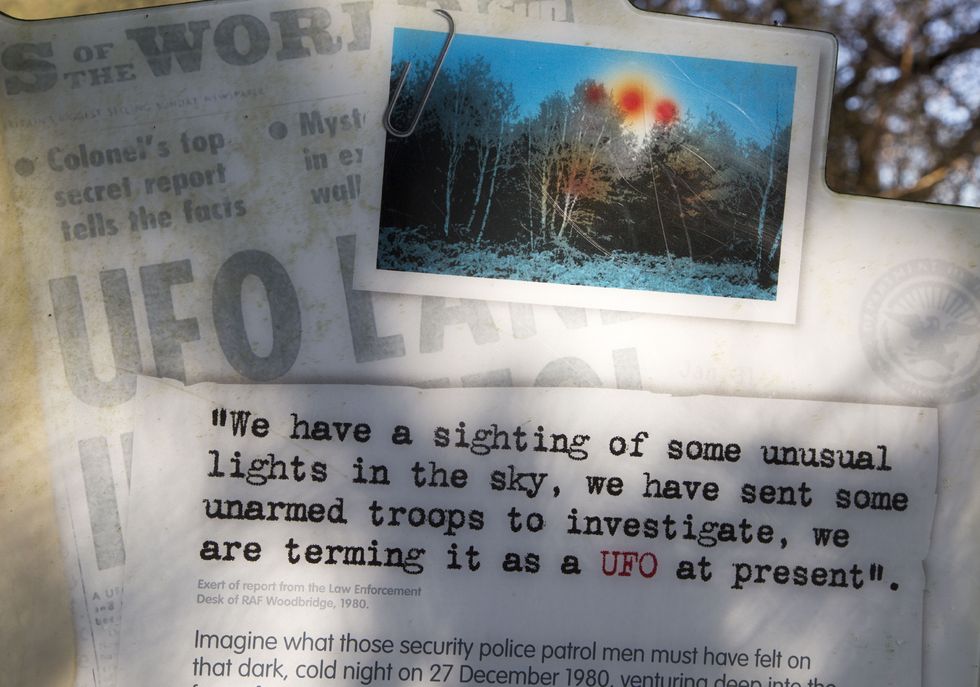 Newspaper headline reports on notice sign at Rendlesham UFO trail, Rendlesham forest, Suffolk, England, UK