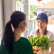 next door 100 winners  woman dropping off groceries at neighbor's house