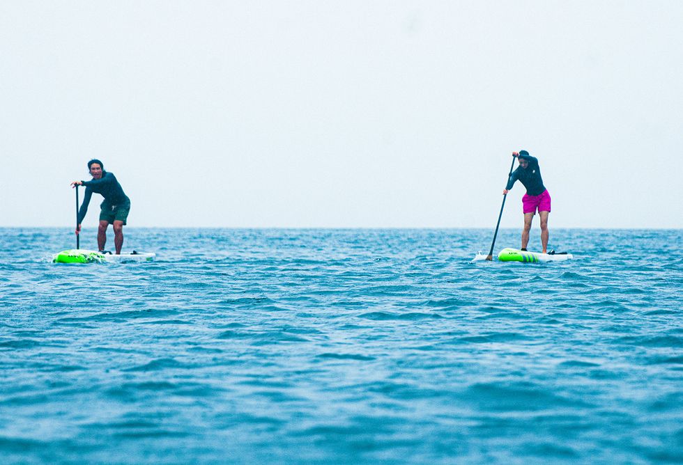 Stand up paddle surfing, Water, Surface water sports, Ocean, Surfing Equipment, Wave, Sea, Water sport, Sky, Recreation, 