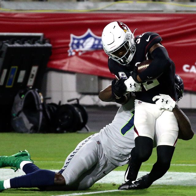 strong safety budda baker 32 of the arizona cardinals is tackled by wide receiver dk metcalf 14 of the seattle seahawks after an interception during the nfl game at state farm stadium on october 25, 2020 in glendale, arizona the cardinals defeated the seahawks 37 34 in overtime