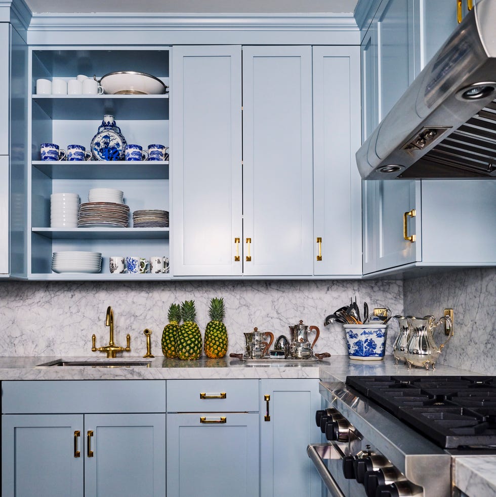 small kitchen blue cabinetry marble backsplash new york city nick olsen