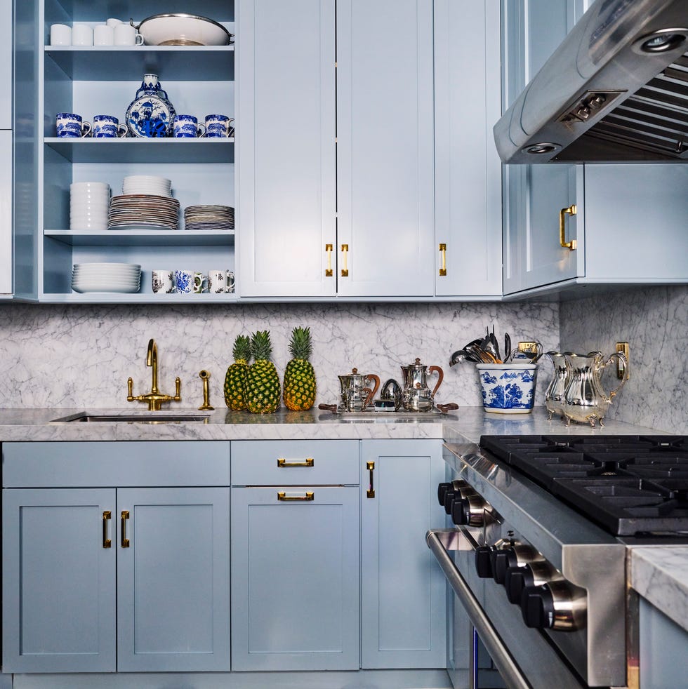 small kitchen blue cabinetry marble backsplash new york city nick olsen