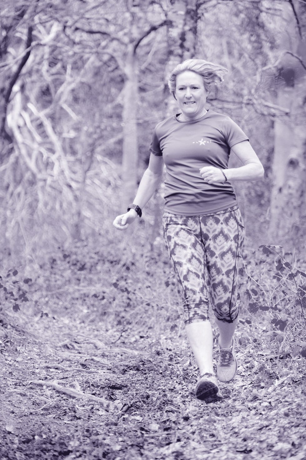Person running on a wooded trail