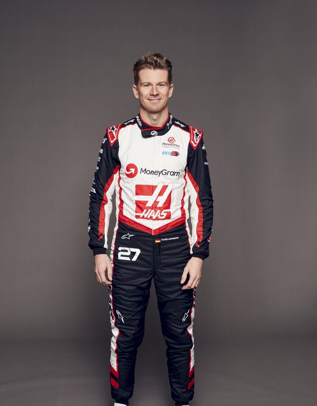 a man wearing a race car uniform