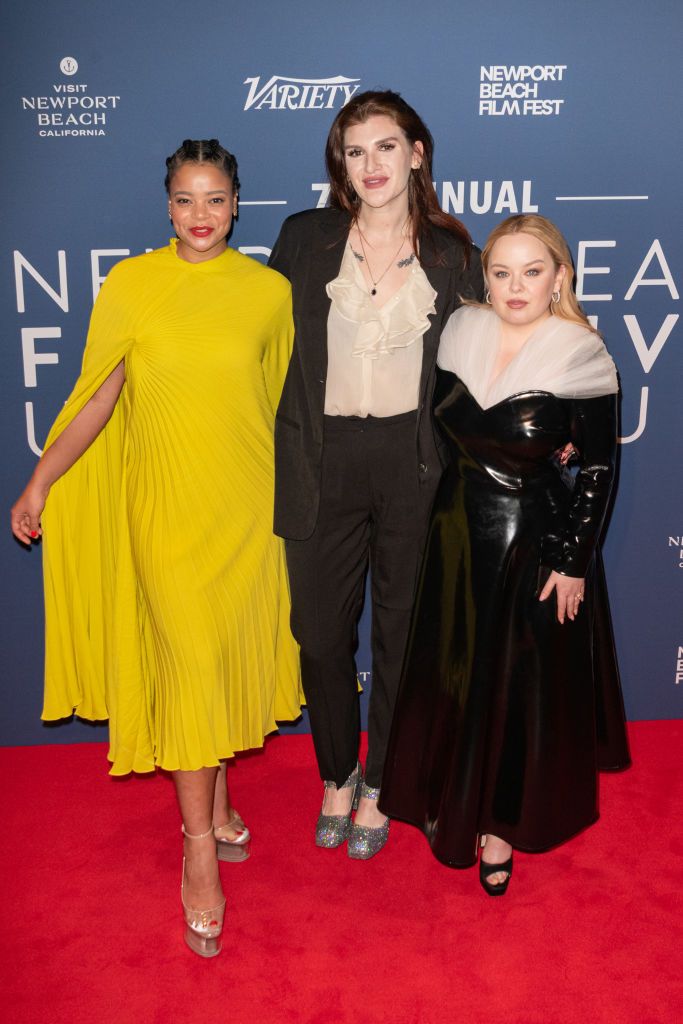 the stars of channel 4s big mood nicola coughlan and lydia west pose for a picture on the red carpet with the director of the show camilla whitehall