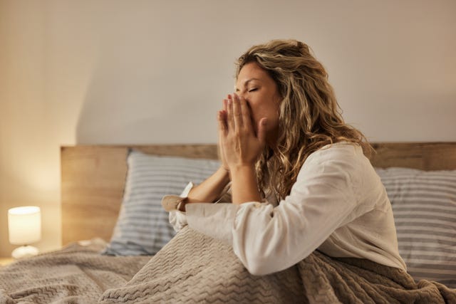 frustrated woman awake in bed at night