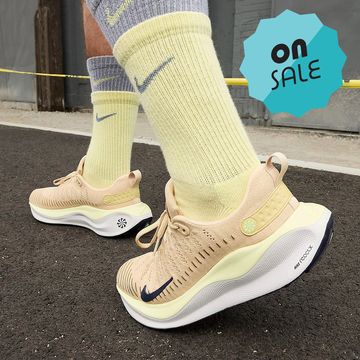 a person wearing tan nike infinityrn 4 Thes, on sale