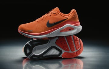 nike running shoes in vibrant orange color with a stylish design