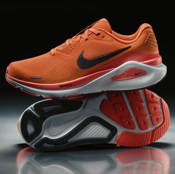 Nike Structure 26 nike running shoes in vibrant orange color with a stylish design