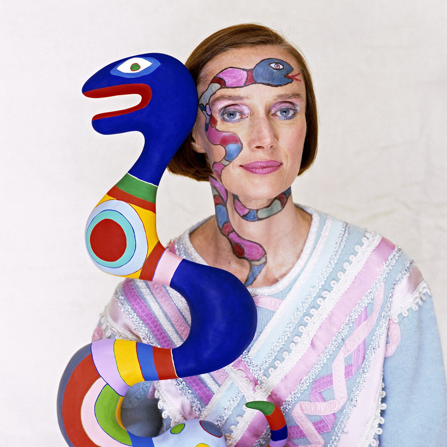 french american sculptor, painter, and filmmaker niki de saint phalle with one of her pieces, 1983