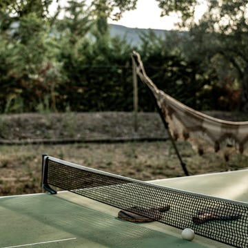 a table and ball on a lawn