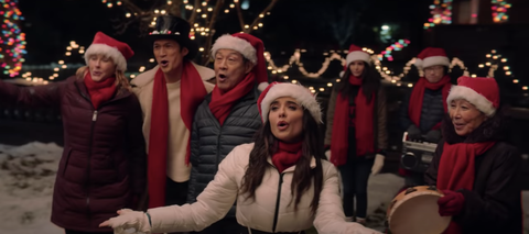 people singing in santa hats
