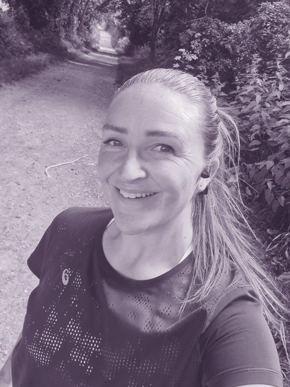 a person taking a selfie while on a nature path