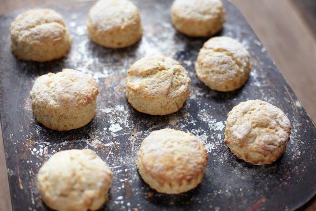 Nine freshly baked scones on baking tray