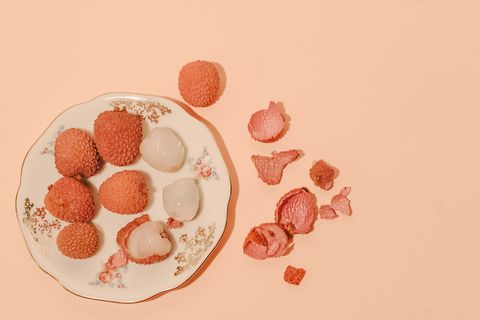nine lychees on a plate