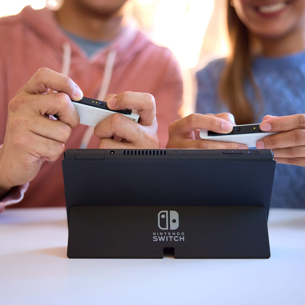 two people playing a game on a nintendo switch