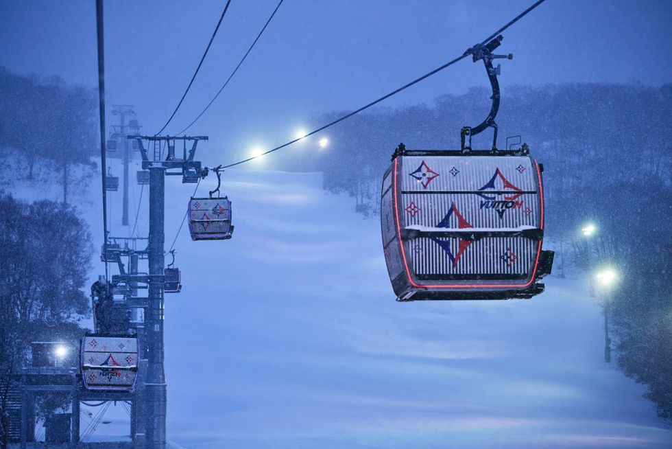 a ski lift with a sign on it