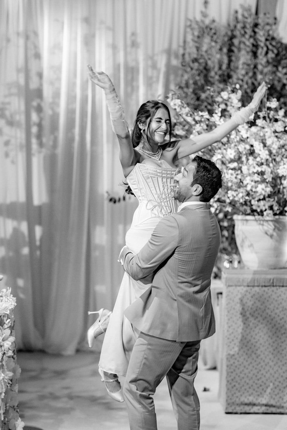 a groom lifting up a bride