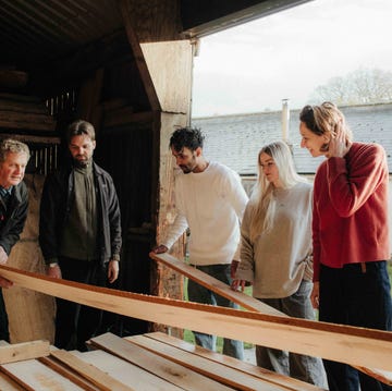 AHEC 3DaysofDesgin a group of people looking at planks of wood