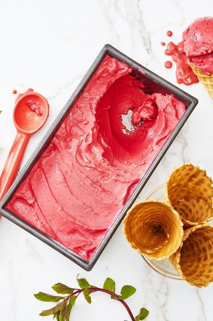 homemade mango berry ice cream in a metal rectangular container